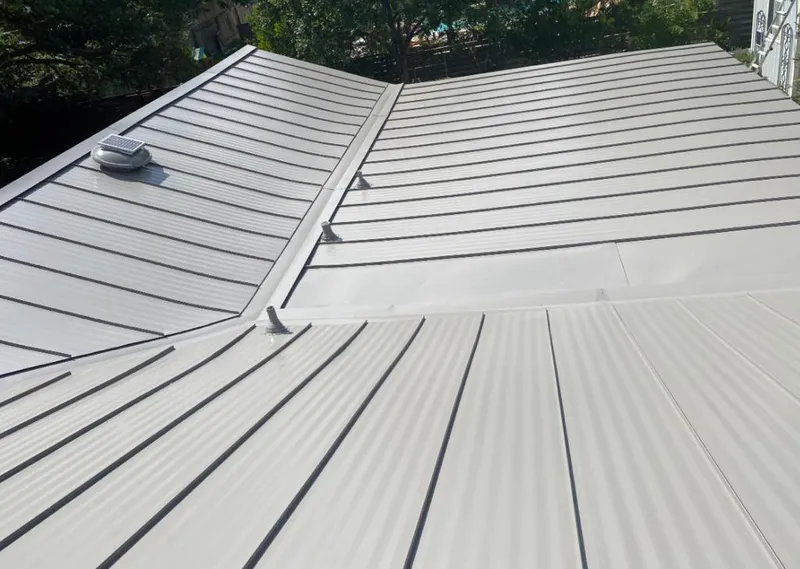 Solar attic fan installed on a metal roof for Roof Ventilation in East Brunswick